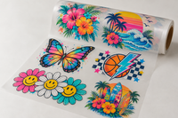 Roll of DTF transfer film printed with a full color gang sheet of tropical, butterfly and sports designs