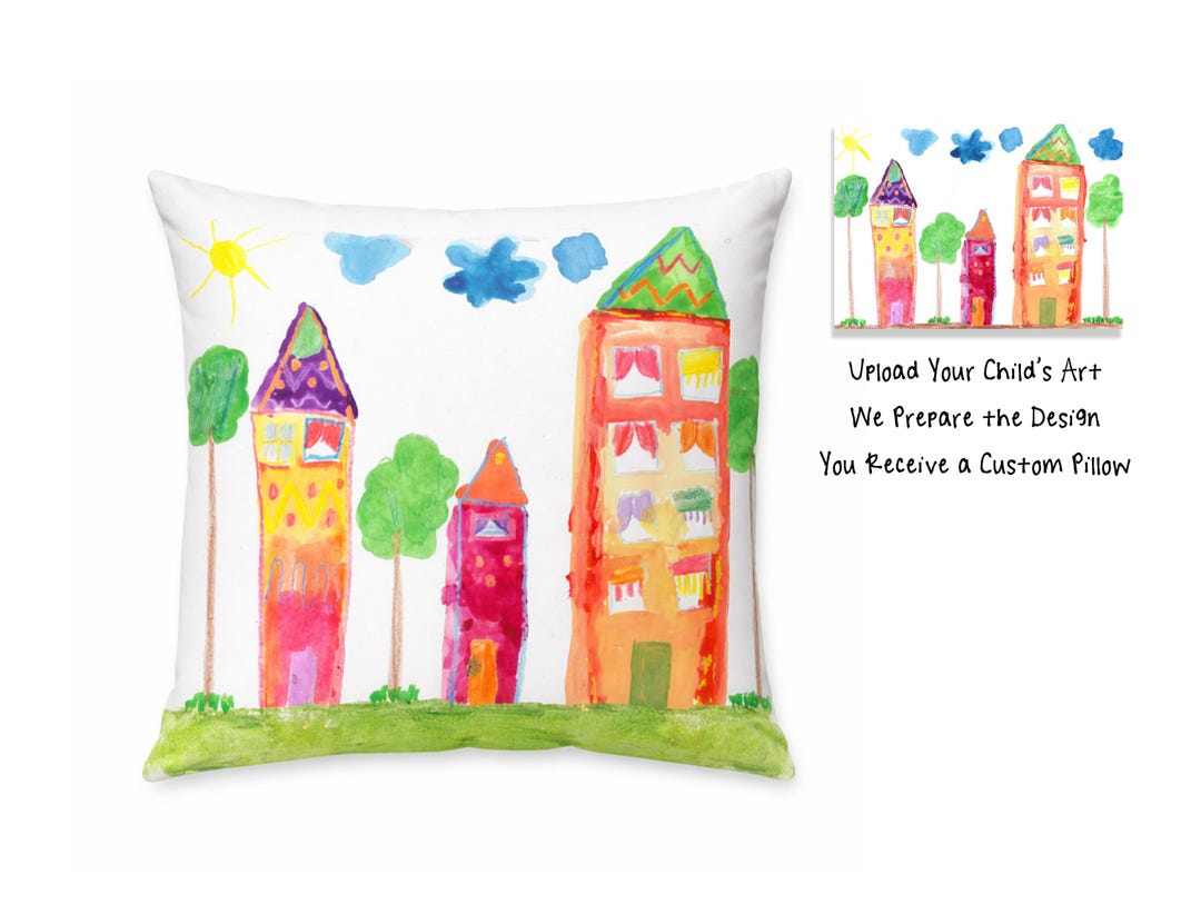 Personalized child artwork pillow featuring kids drawing printed on white pillowcase